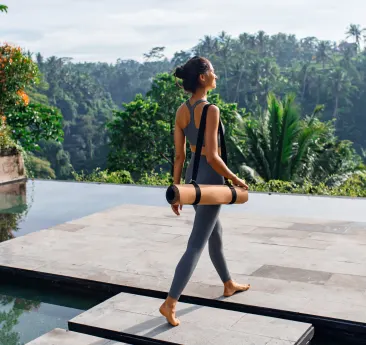 Women with a yoga mat