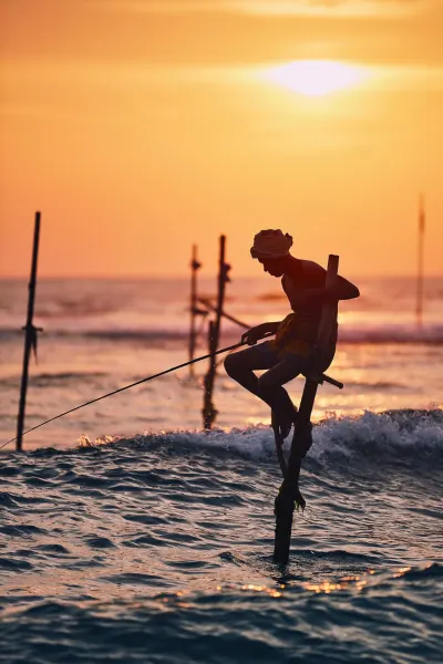 Traditional stilt fisher, luxury travel holiday, Sri Lanka