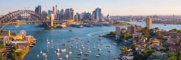 Shot of Lavender Bay, Sydney Harbour. The Sydney Harbour Bridge, Luna Park, and several sail boats are also in shot
