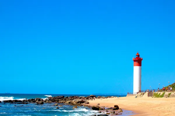 Beach with lighthouse in distance
