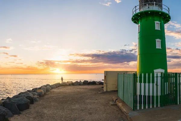Lighthouse with sunset in background