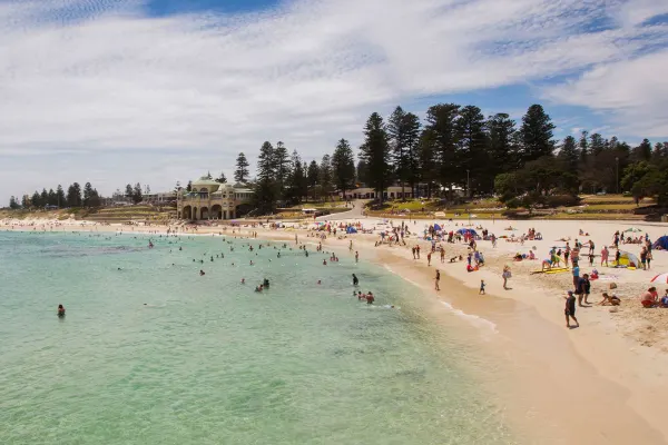 Beach with water, sand and people