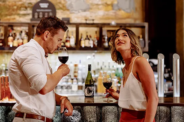 Couple drinking wine in a bar