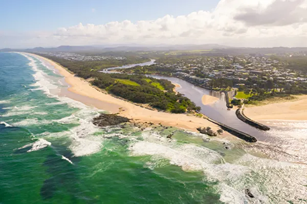 beach connecting to a river in kingscliff