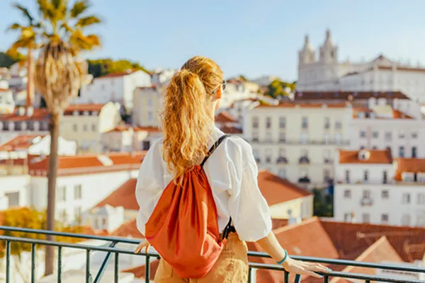 Woman looking out at the city of Lisbon