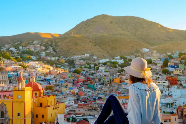 Woman admiring Guanajuato city and the basilica, Guanajuato, Mexico