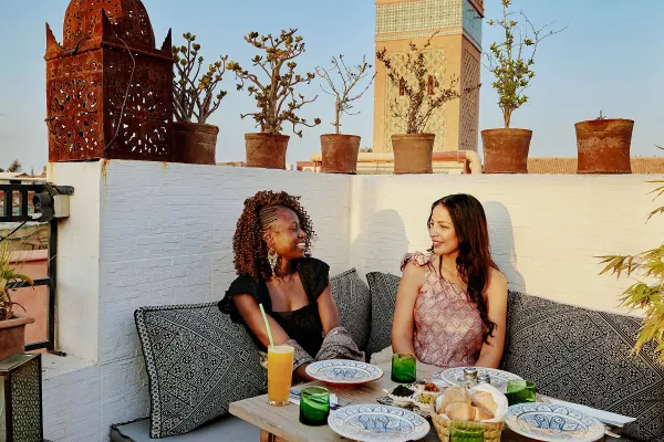Couple having lunch on a rooftop in Morocco