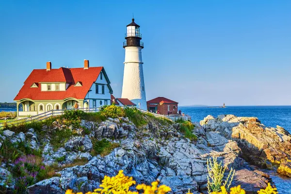Lighthouse and small house on a hill