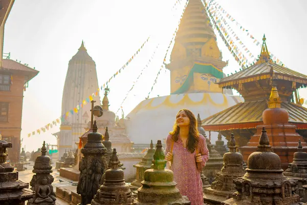 Women walking through multiple small shrines in Nepal