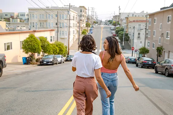 two girls walking down street in san francisco