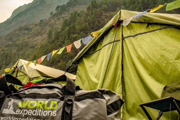 Camping bag in front of tent