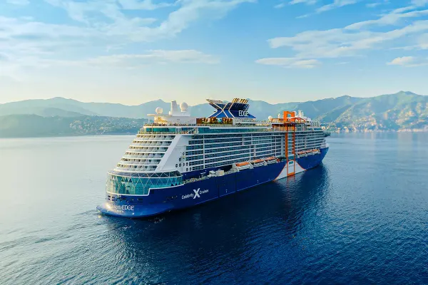 Cruise ship with green hills in the background