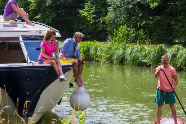 River boat and paddle board