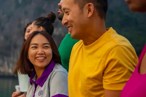 Group of people overlooking side of boat in Thailand