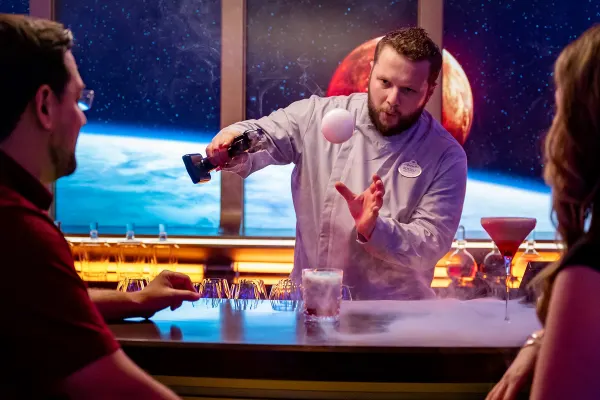 Man making a cocktail in a fancy bar
