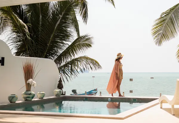 Women walking by pool tropical destination