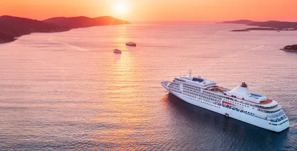 Aerial of Cruise ship at sunset