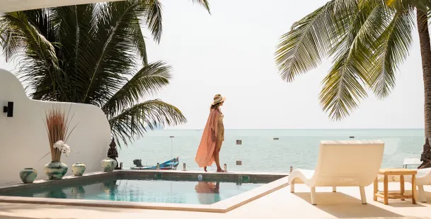 Women walking by pool tropical destination