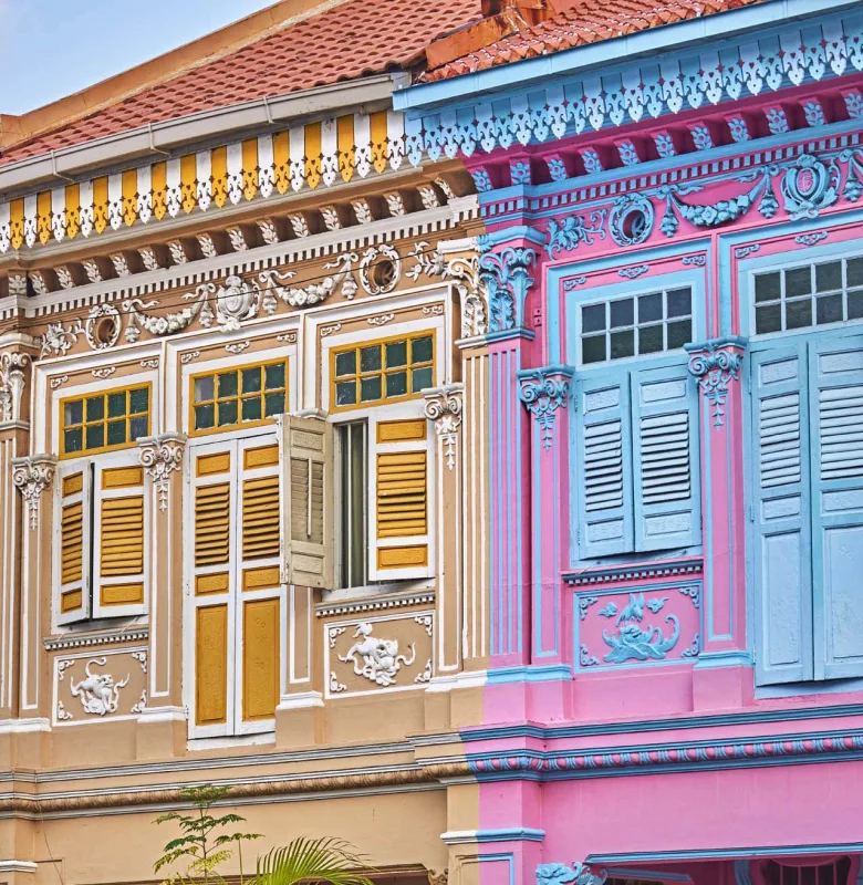 See Koo Seng Road's pastel townhhouses during a luxury travel holiday to Singapore.