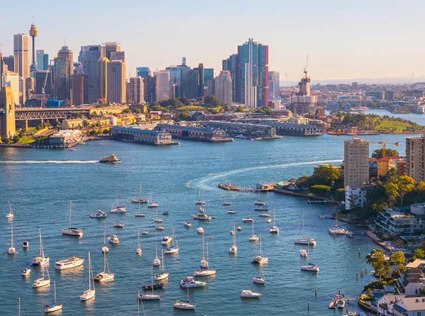 Shot of Lavender Bay, Sydney Harbour. The Sydney Harbour Bridge, Luna Park, and several sail boats are also in shot