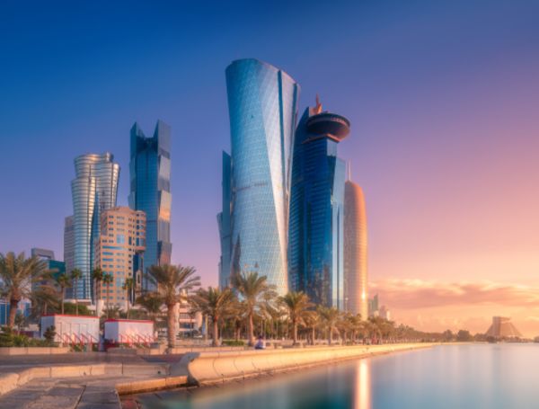 the Doha cityscape at sunset