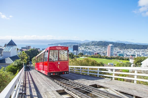 Red tram on a steep hill in Wellington