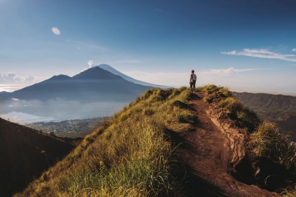 Male hiker looking at view from top of mountain