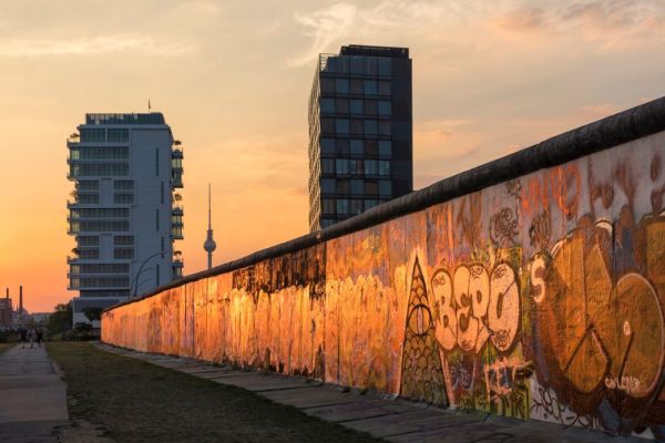 Sunset reflecting off a graffiti art city wall in Berlin