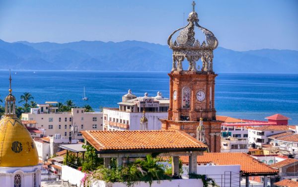 Town of Puerto Vallarta with town clock as focal point and ocean/mountains in background