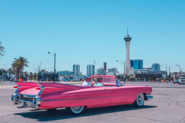 Vintage pink car in front of the Stratosphere
