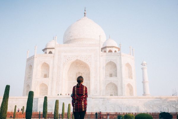 Woman standing in front of the Taj Mahal