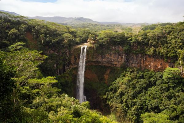 Distant shot of water falling from a large waterfall in Mauritius