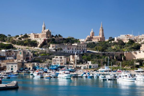 Boat marina in front of town houses in Malta