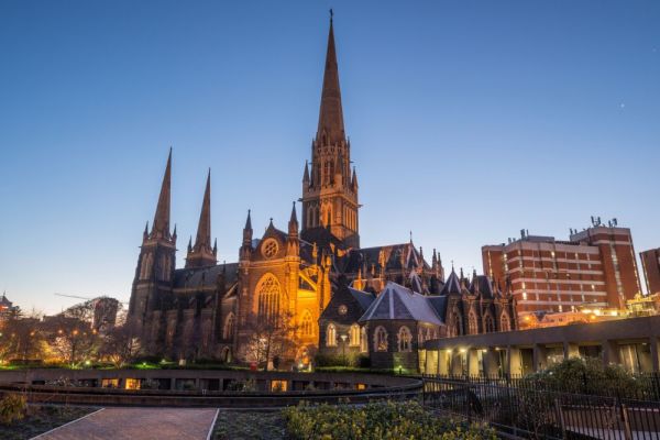 St Patrick's Cathedral lite up by ground lights during dusk