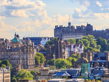 Mountain view of the city of Edinburgh with clock tower as focal point