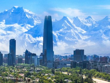 Panorama of Compostela with greenery at the bottom, skyscrapers in the center of shot and snowy mountains in the background