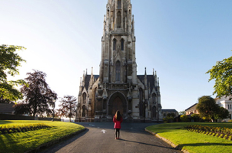 Walking in front of Church of Otago