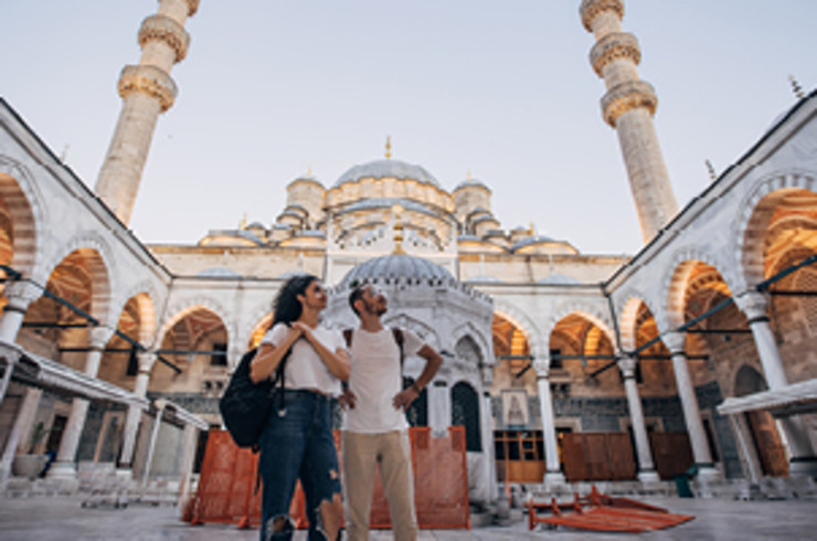 man and lady looking at building in istanbul