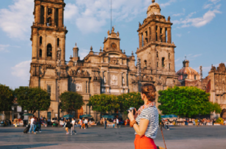 lady standing in front of old building in mexico city
