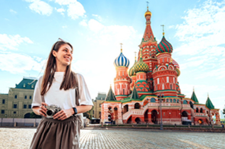 lady standing outside colourful building in moscow