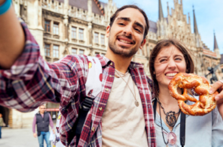 couple taking a selfie out the front of building in munich