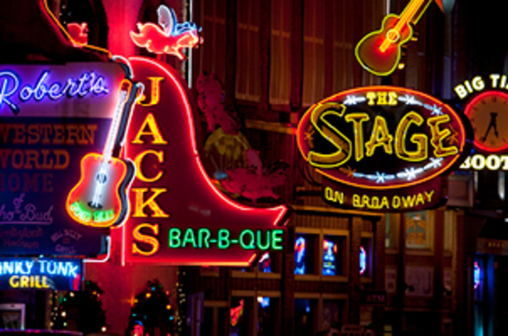 neon signs on streets of nashville at night