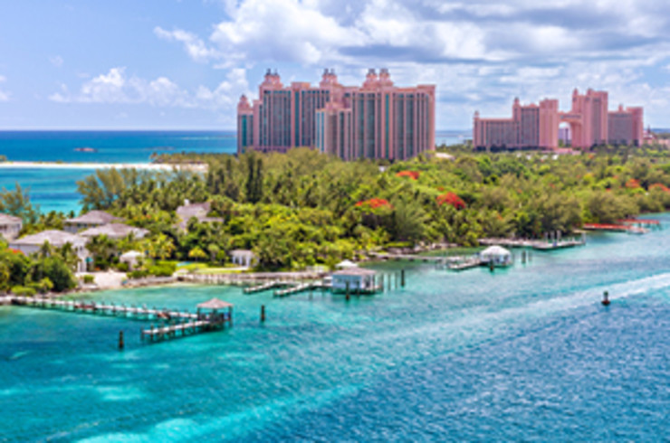 island of nassau surrounded by blue water with greenery and hotels on land
