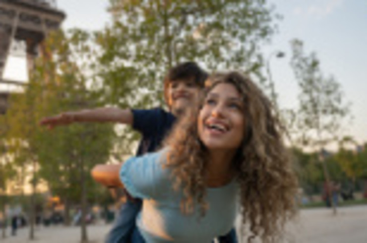 Mother and son in front of the Eiffel Tower