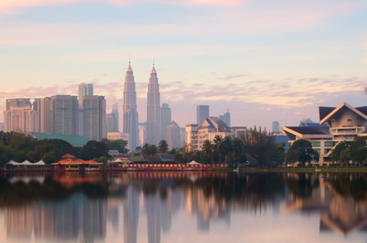 kuala lumpur city by the water at sunset