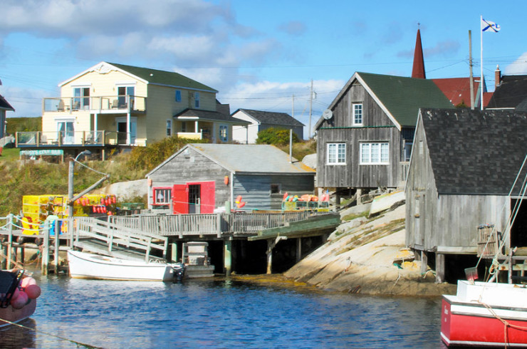 Fishing town with weathered buildings, fishing boats and a church