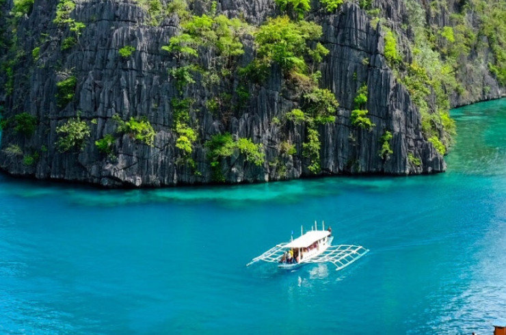 Tall rocky islands in calm blue water