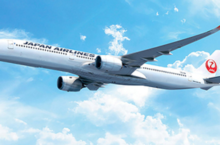 Japan Airlines plane flying through the sky