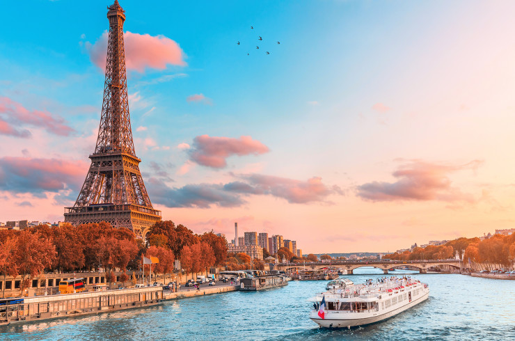 Eifel Tower along the river with a stunning blue-pink sunset in the background
