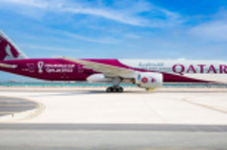 A view of a Qatar Airways airplane that is preparing to leave the airport on a booked flight.